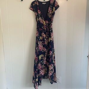 Floral high-low short sleeve wrap dress.